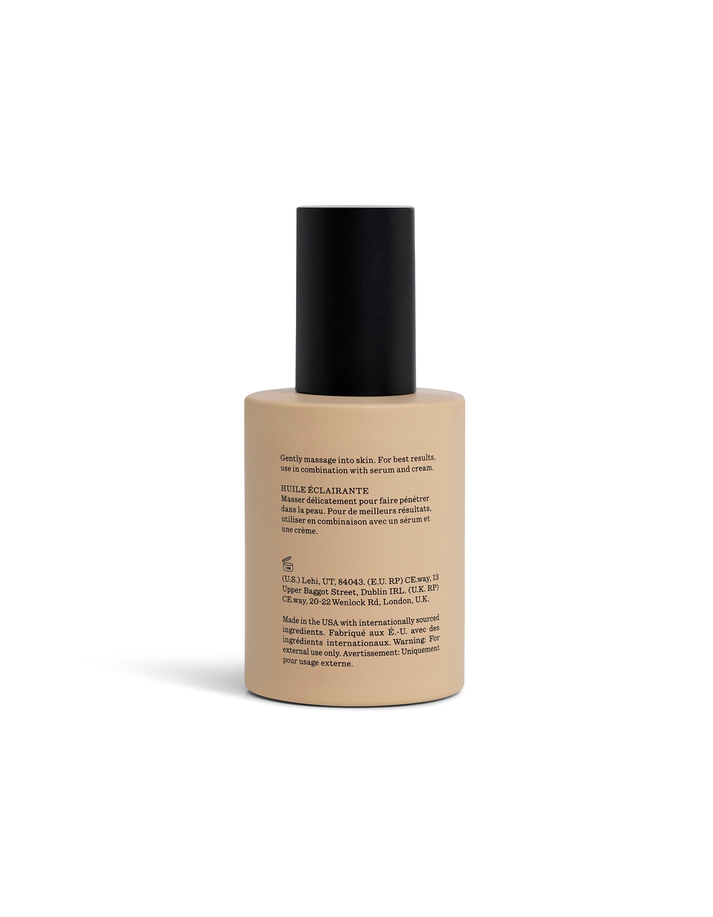 Brightening Vitamin C Oil in beige bottle turned backwards with black cap