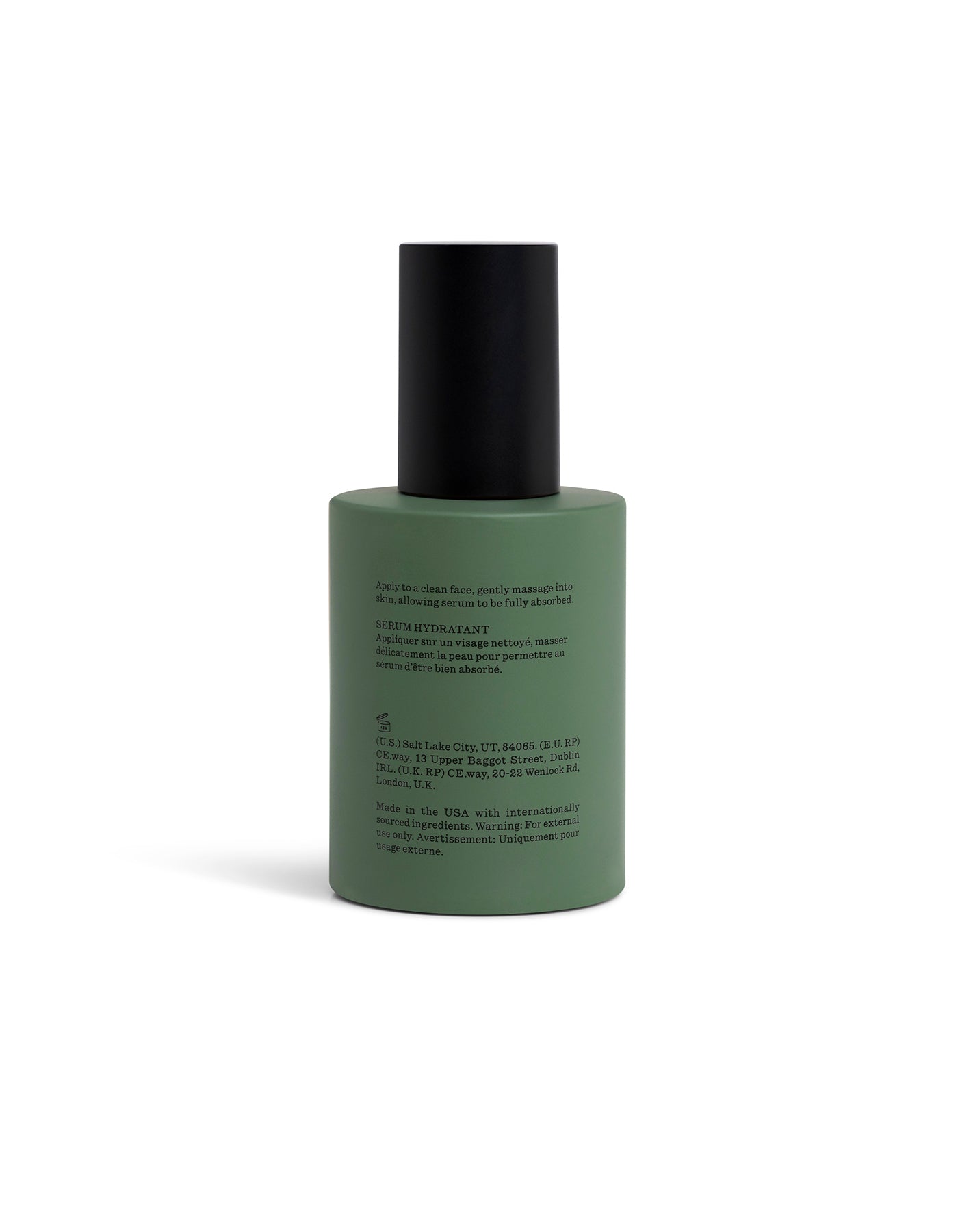 Green bottle with black cap on a white background