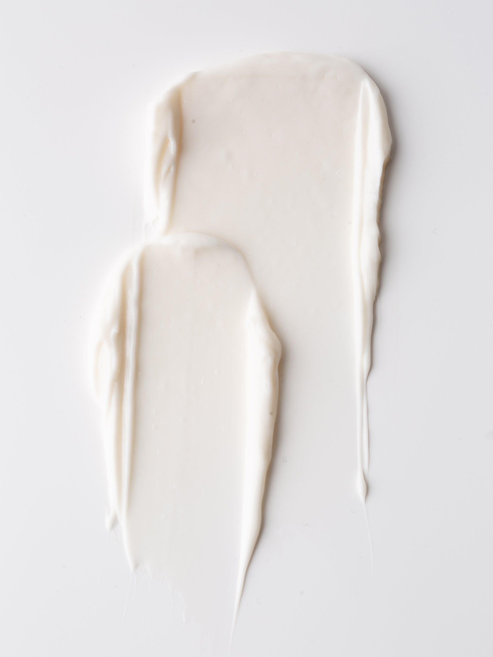 Two streaks of white body butter on a light gray background |Size:Mini
