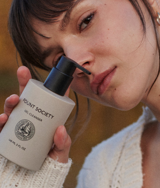 Woman holding Fount's Gel Cleanser product