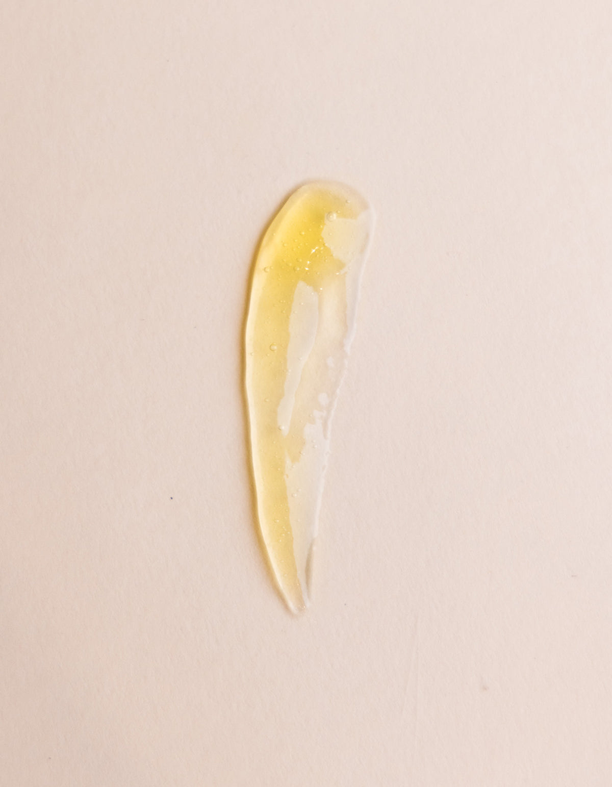 A yellow smear of Fount Society Enzyme Mask on a beige background |Size:Full Size