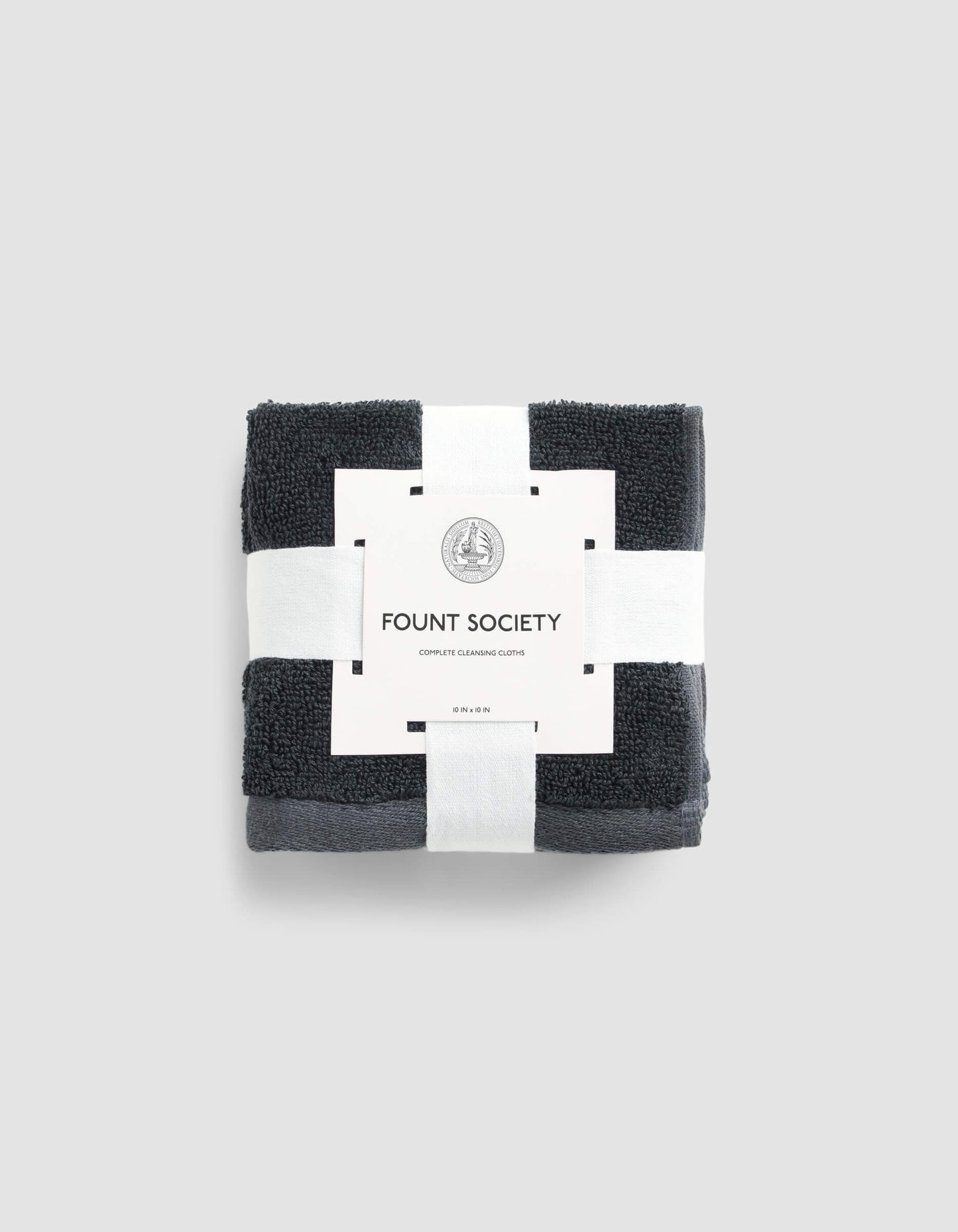 A stack of 4 dark grey washcloths wrapped in packaging |Color:Graphite