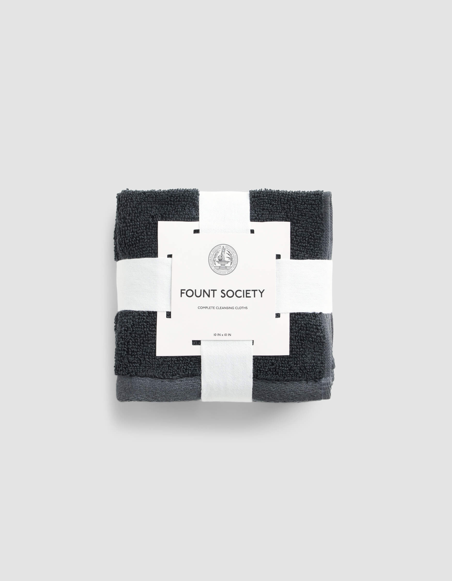 A stack of 4 dark grey washcloths wrapped in packaging |Color:Graphite