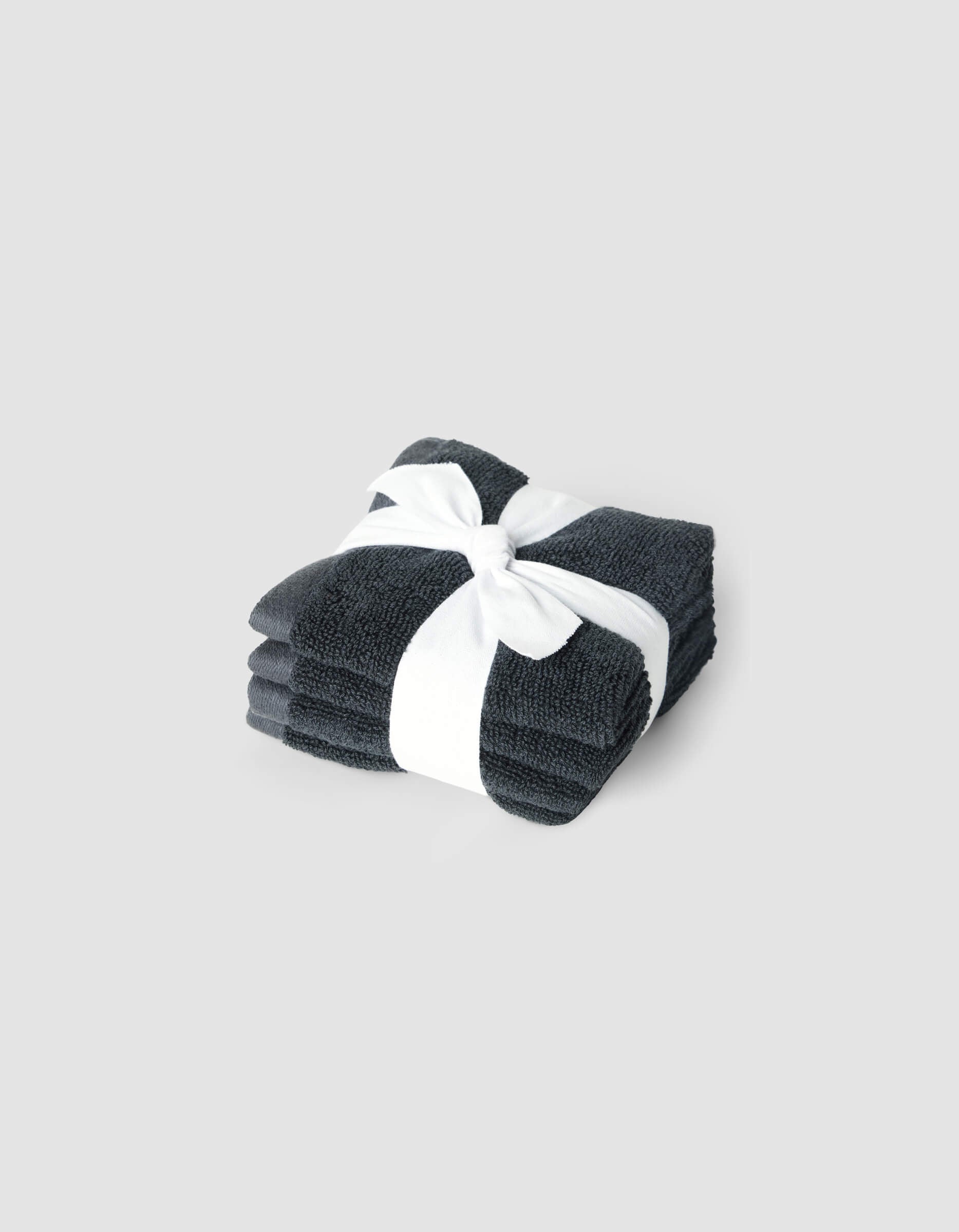 A stack of 4 dark grey washcloths tied with a white ribbon |Color:Graphite