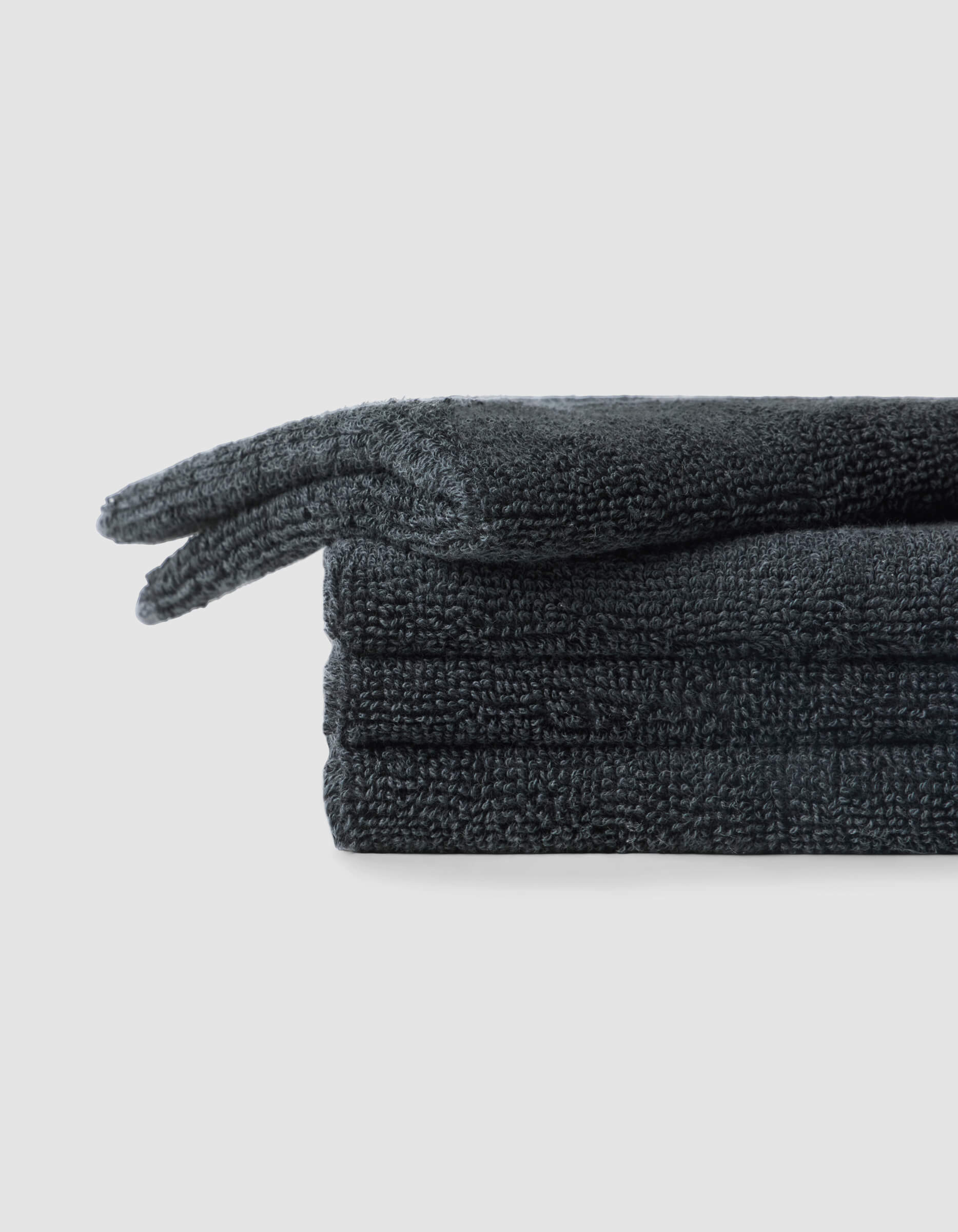 A stack of 4 dark grey washcloths |Color:Graphite