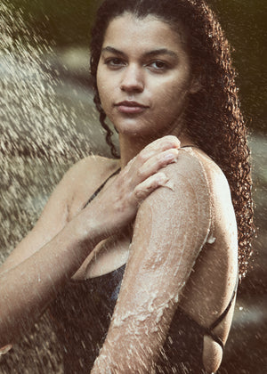 Woman washing her arm